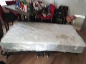 Its  a bed with no damage brand new plastic on it