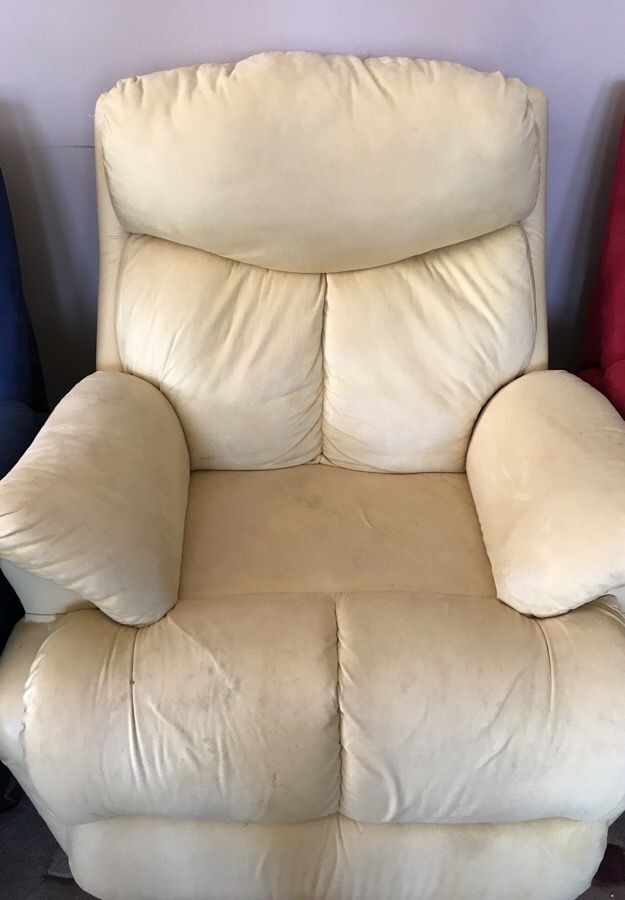 Light yellow reclining sofa chair