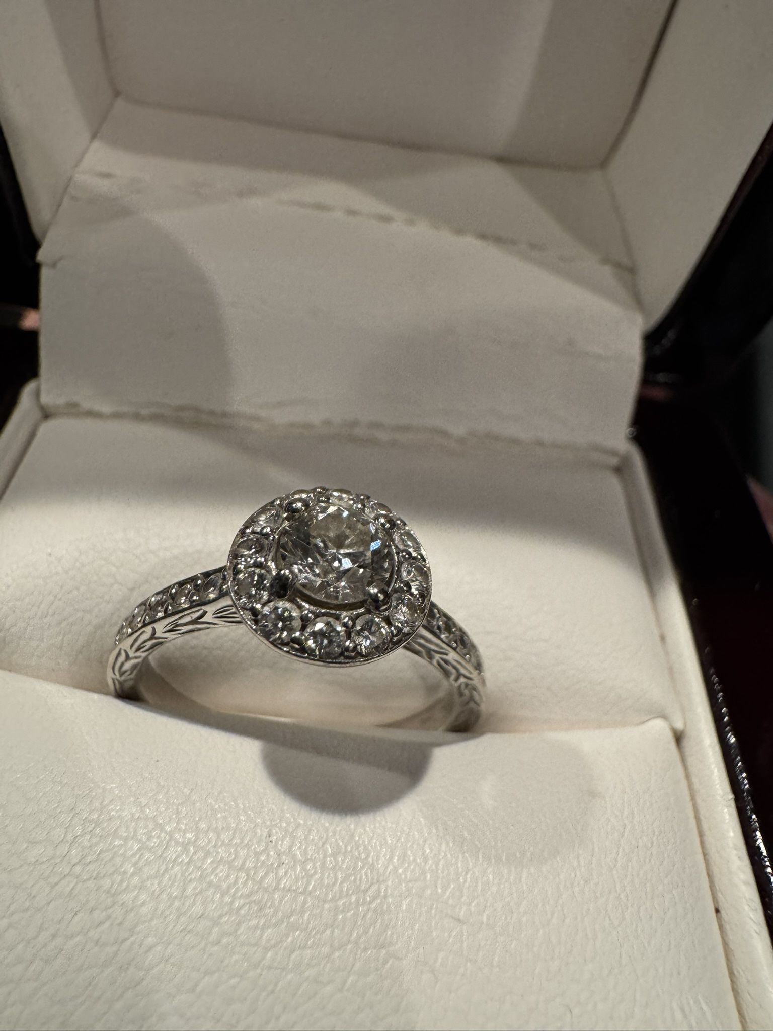 Na Hoku engagement ring. 3/4 Carat center, halo with and side diamonds.