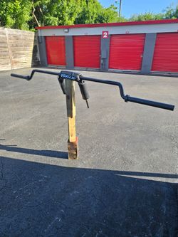 This item is the Rogue SB-1 Safety Squat Bar. It is a specialty barbell heavily utilized for squatting movements because it shifts the weight distribu
