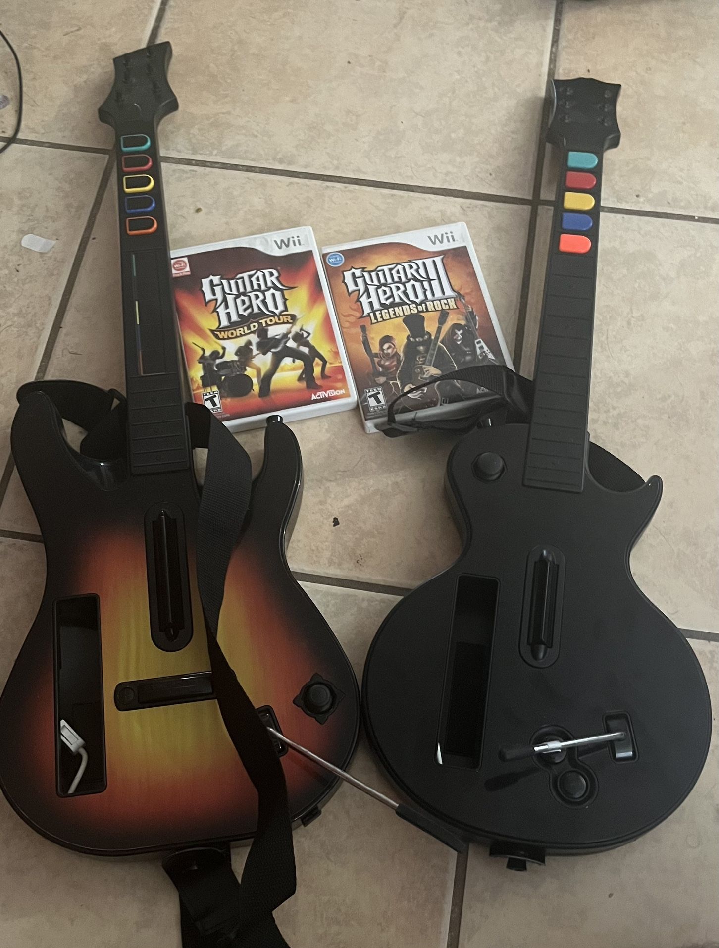 Wii Guitar Hero Controllers + GH: World Tour And GH3 Games