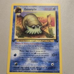first edition Omanyte Pokémon card 52/62 Fossil 1999 TCG