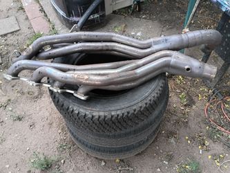 Set of Stainless Works long tube headers and mufflers for a Ford 6.2 l