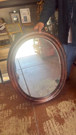 Oval antique mirror by Ethan Allen