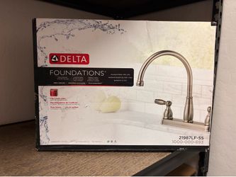59 Dlls Kitchen Faucet in stainless steel  Brand new in the Box
