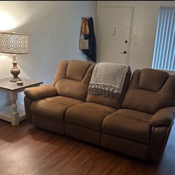 Jeromes Reclining Couch, Coffee Table And Lamp