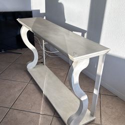 Tv stand / behind a couch table