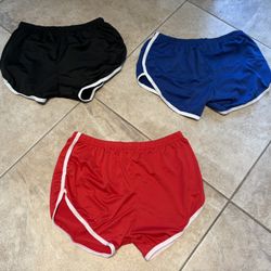 New 3-Pack Sports Shorts in Black, Blue & Red. 95% polyester 5% spandex. No tag. No brand. Size XL. Run small.