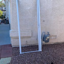 White screen door of the house or the garage the width is 34 1/2 the length is 81 1/2 asking $100