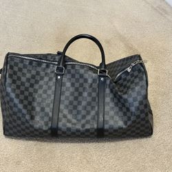Authentic Louis Vuitton Keepall Bandoulière 55 in the sleek Damier Graphite canvas
