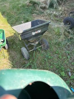 Tow behind spreader