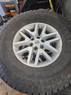 Nissan frontier  oem wheels and tires 285 75 16