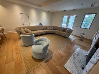 Two turquoise swivel chairs