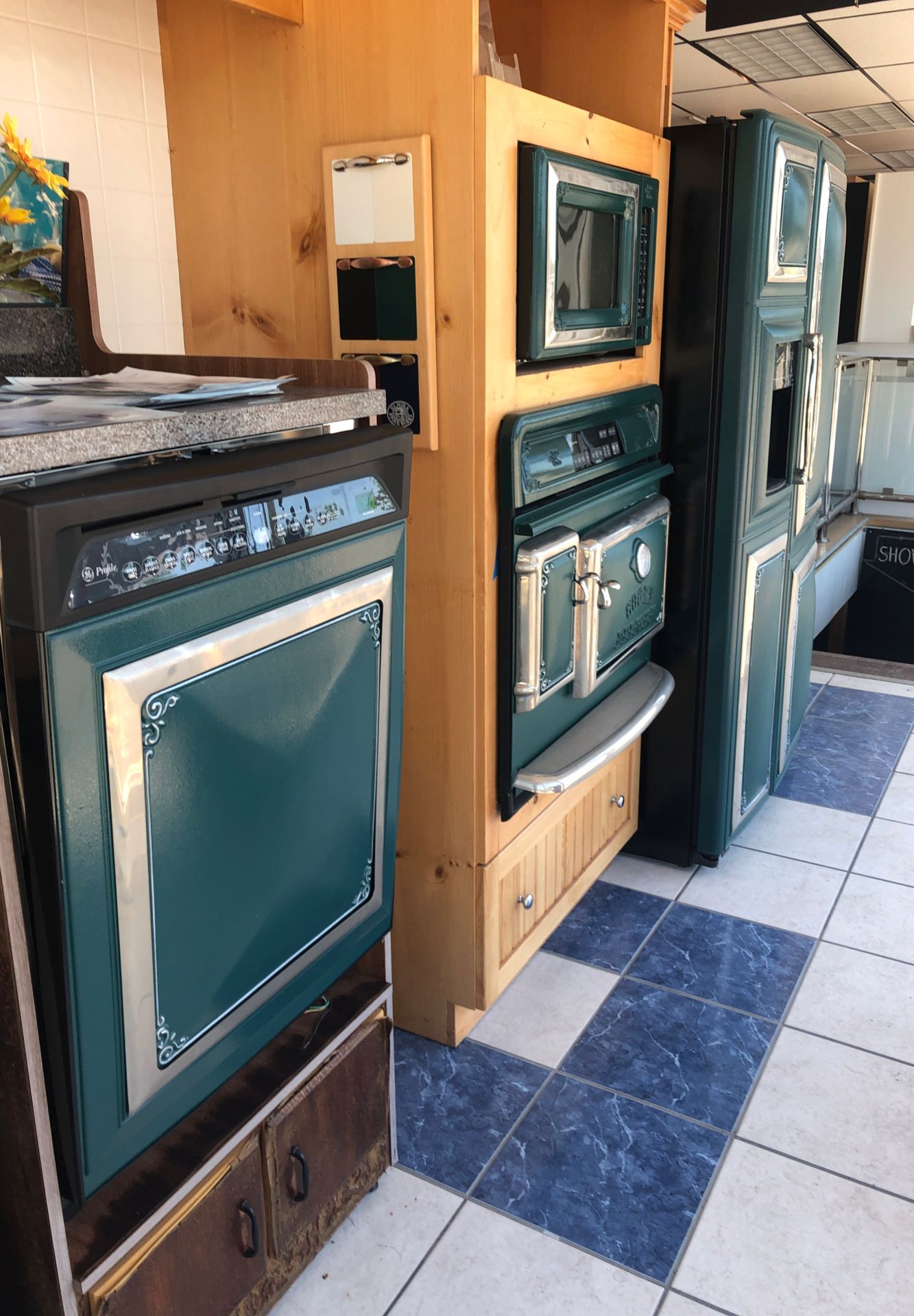 All appliances made by GE with the Elmira Trim. Gorgeous set of 4 appliances. Refrigerator, wall oven, microwave, and dishwasher. The retail price is