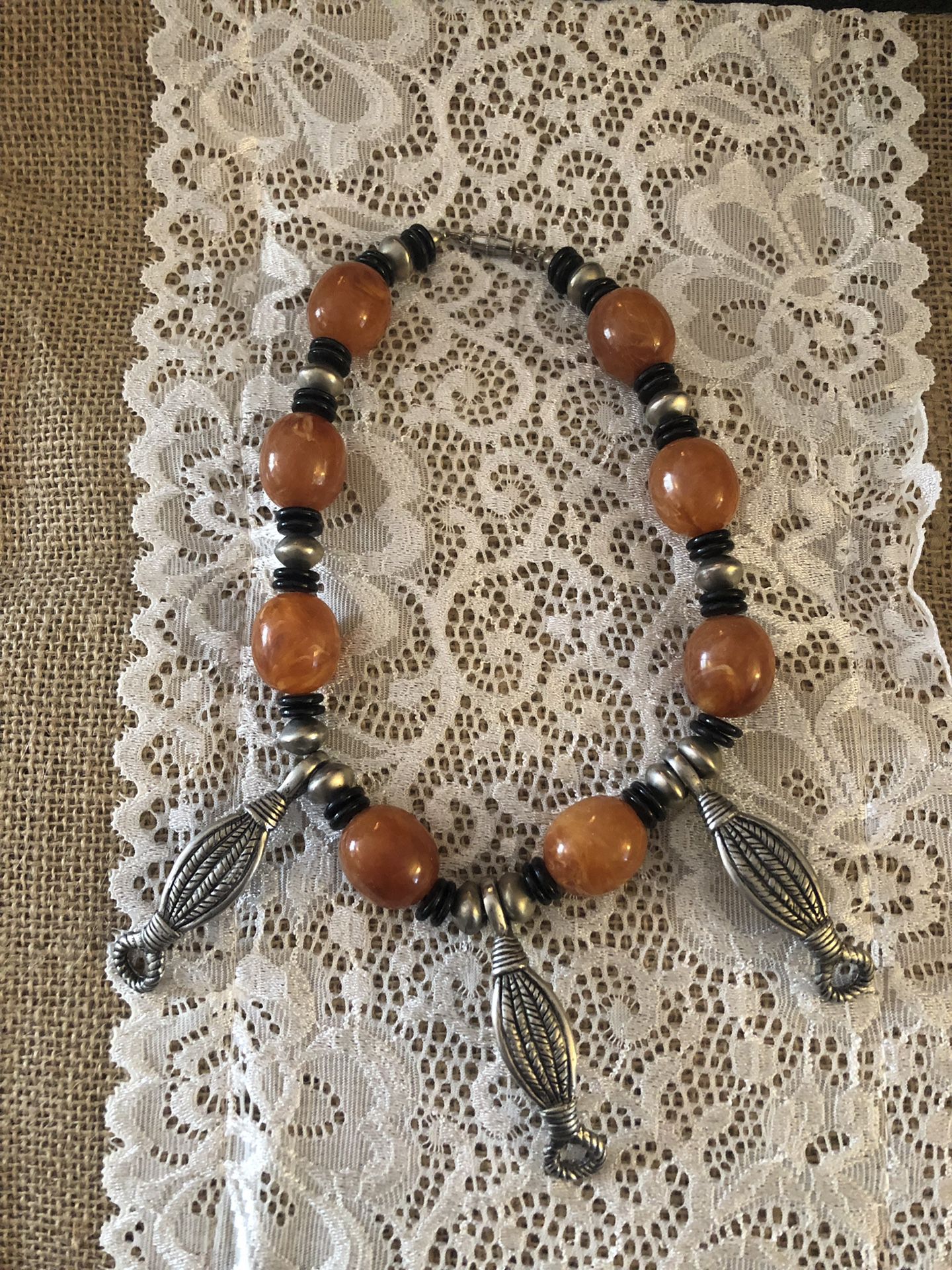 Silvertone and amber colored necklace
