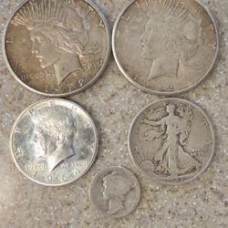 Two 1922 "S" Peace Dollars And One 1942 Walking Liberty  One 1917 Mercury Dime Coins And One 1964 Kennedy Half Dollar All 90% Silver