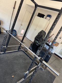 Power Rack with Barbell and Weight Plates