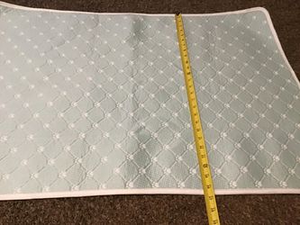 Light blue with white paw prints dog cooling mat
