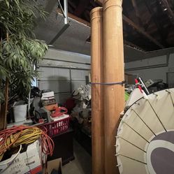 2 Large, unfinished wooden columns