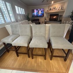 Four counter stools upholstered and comfortable