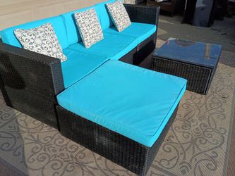 Outdoor wicker furniture with glass top table