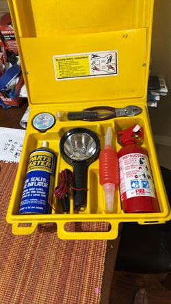 Roadside personal assistance kit with fire extinguisher, 12volt high beam light, tire inflator, gas dispenser, tools, tape