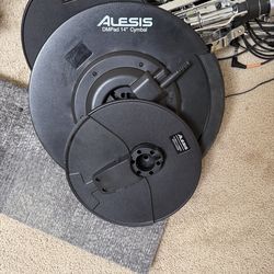 Alesis Drum kit with double bass pedal and DW set in working condition.