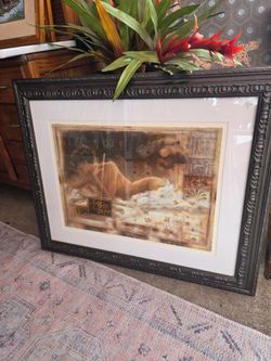 Decorative painting in a classic or Impressionist style depicting a female figure reclining on sheets or white foam, featuring sepia and ochre tones.