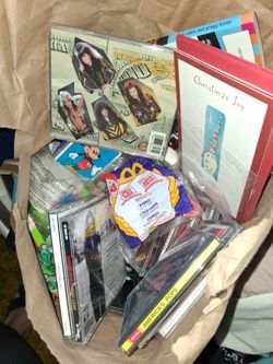 Mixed Lot of CDs, Books, and Collectibles