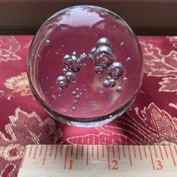 Crystal ball paperweight with bubbles inside