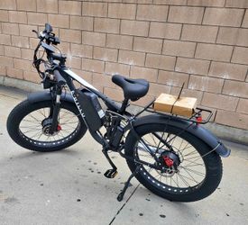 52v23ah Up to 38 mph Dual motor  3000w Dual motor peak 26in tires  Like new