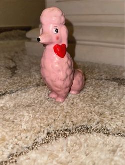 Pink poodle figurine with red heart