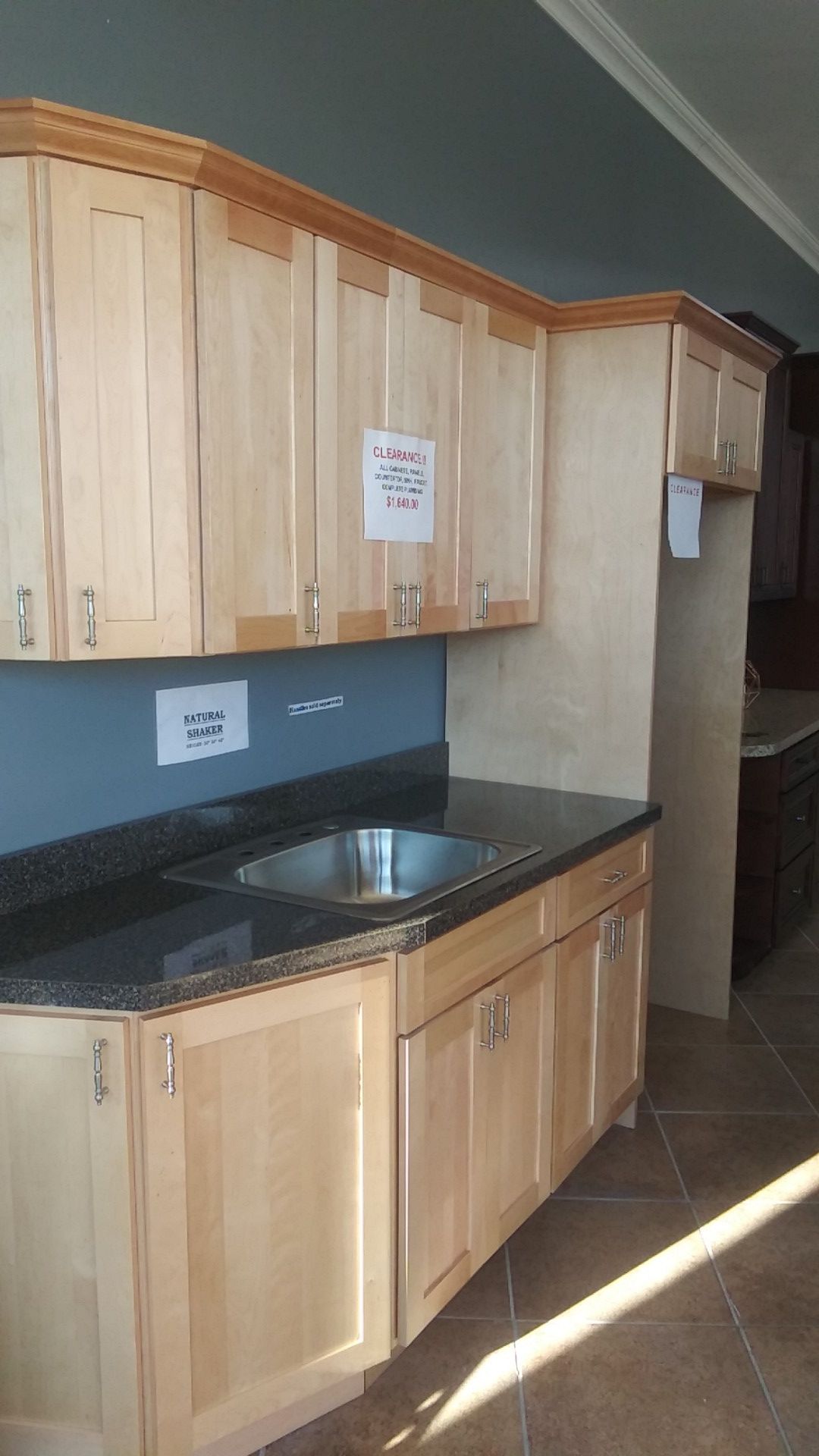 Beautiful natural shaker kitchen cabinets selling floor model kitchen as seen with sink and countertop