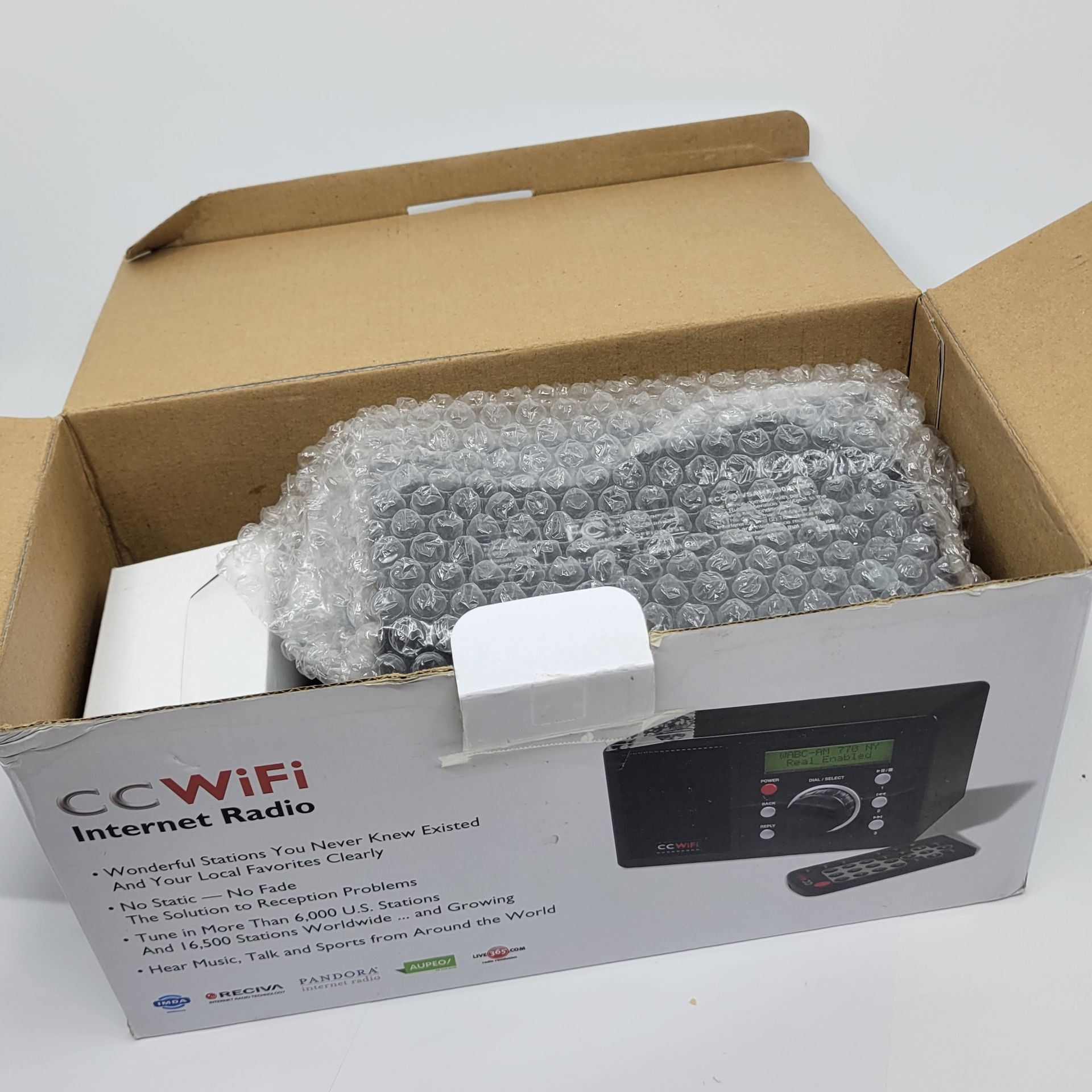 C. Crane CC WiFi Internet Radio , Clock and Alarm New Open box.Including power supply, remote, radio. Manual is missing.Weight 2lb plus shipping ma