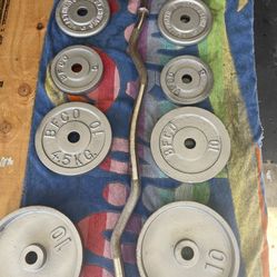 Weight Plates / Curl Bar      55 Dollars 