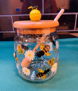 Beautiful vintage glass honey pot with hand painted bees, wooden lid and honey dipper