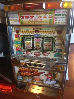 2 amusement slot machines keys and tokens included