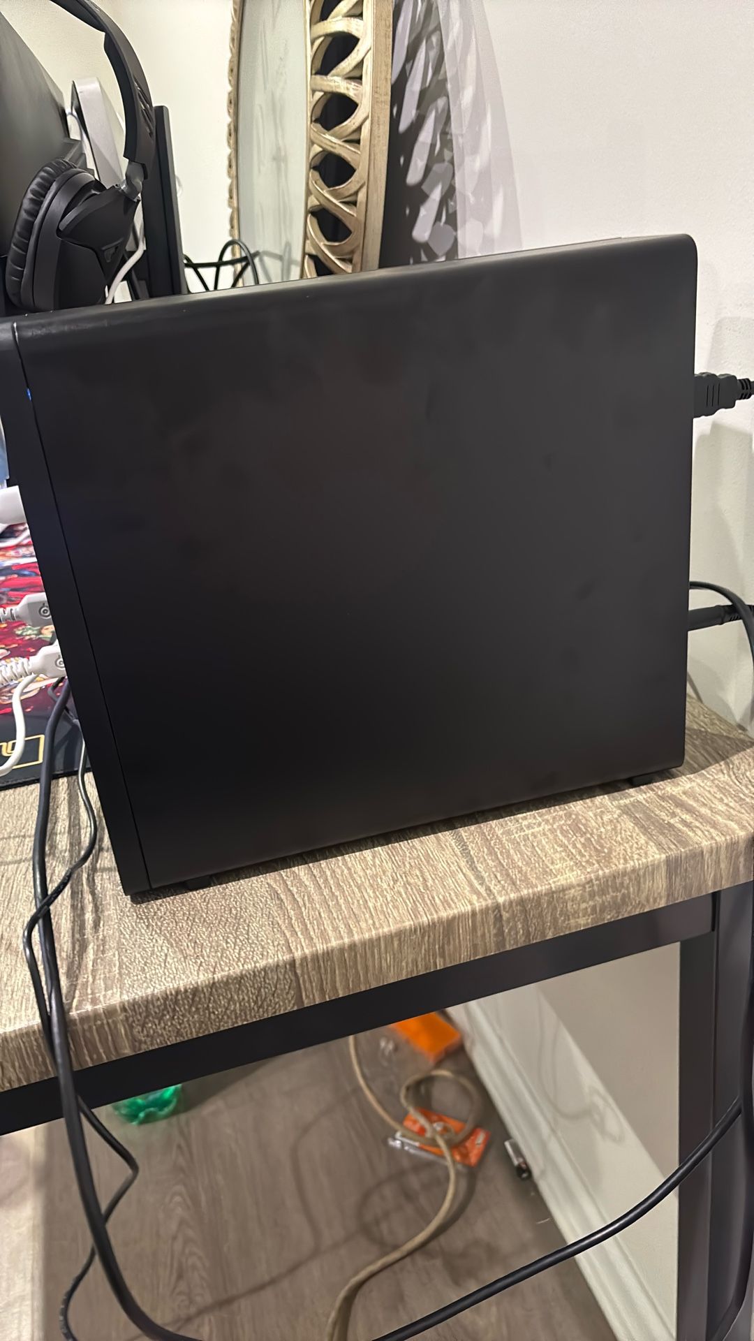 It’s a PC and comes with a keyboard and mouse