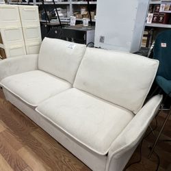 white fabric two-seater sofa or loveseat
