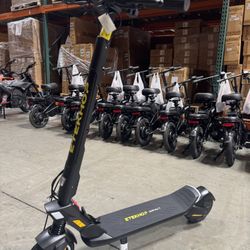 Front and rear shock-absorbing electric scooters