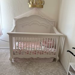 White crib and changing table
