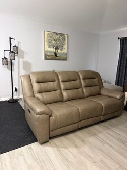 Leather power reclining sofa