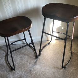 2 wood and rod iron bar stools