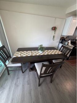 Dining table with bench it has 4 chairs.