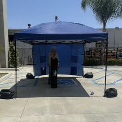 New In Box 10x10 Feet EZ Pop Up Canopy Portable Navy Blue Gazebo With 1 Side Wall And Carrying Case And Sand Weight Pouches 