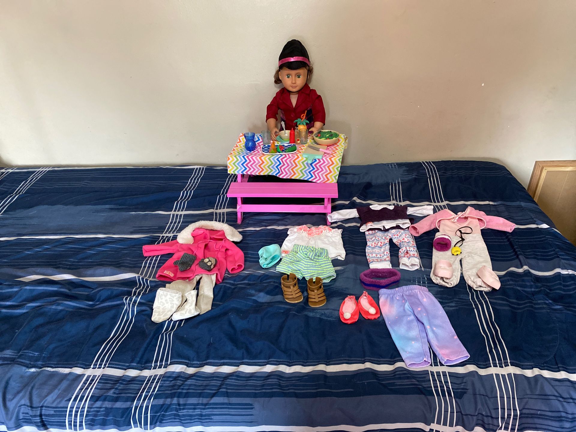 Doll with full sets of clothes and dinner set