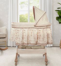 Rocking bassinet with wheels. Included music and vibrations.