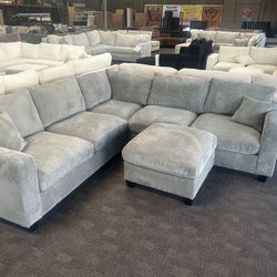 New Grey Sectional And Ottoman