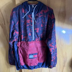 Tommy Jeans x Looney Tunes Space Jam Windbreaker Jacket in navy blue and red Flaws as seen in the last two pictures (two small holes)  Xl on tag