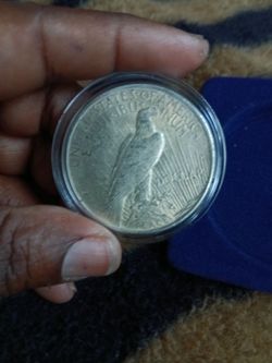 One dollar peace liberty coin